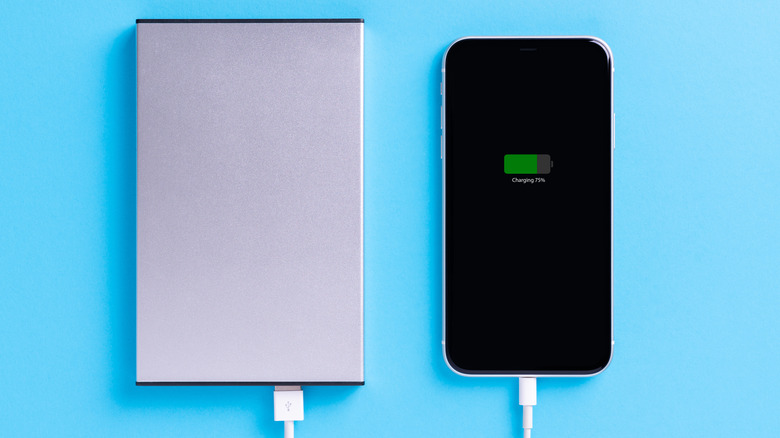 iPhone plugged into power bank