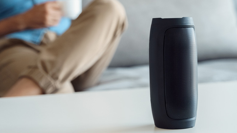 Person using Bluetooth speaker