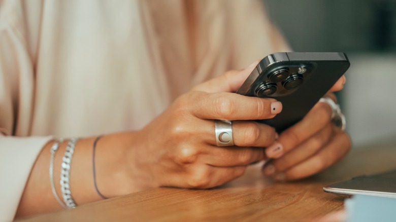 woman with iphone 14 pro max