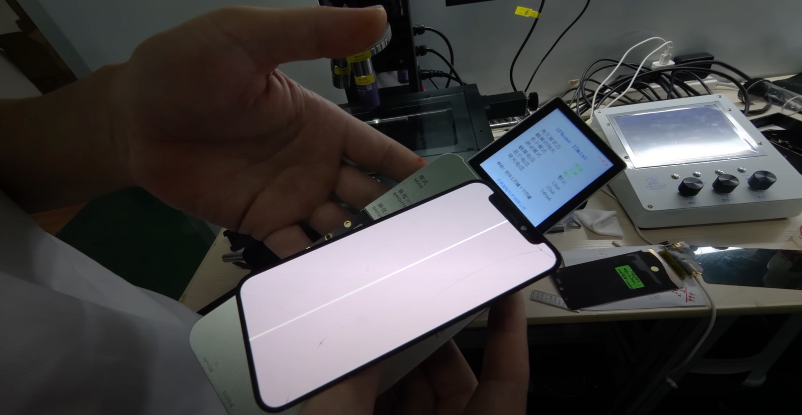 A laser machine can repair lines that can appear on OLED panels like the iPhone's.