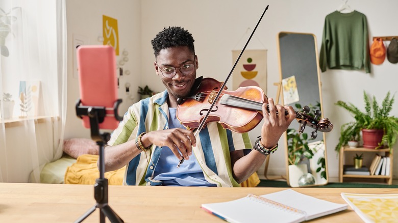 man playing violin 