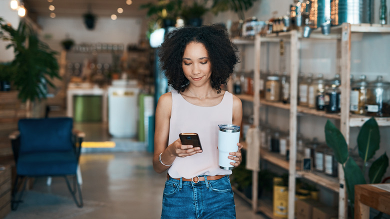 Shot of a young woman using a smartphone