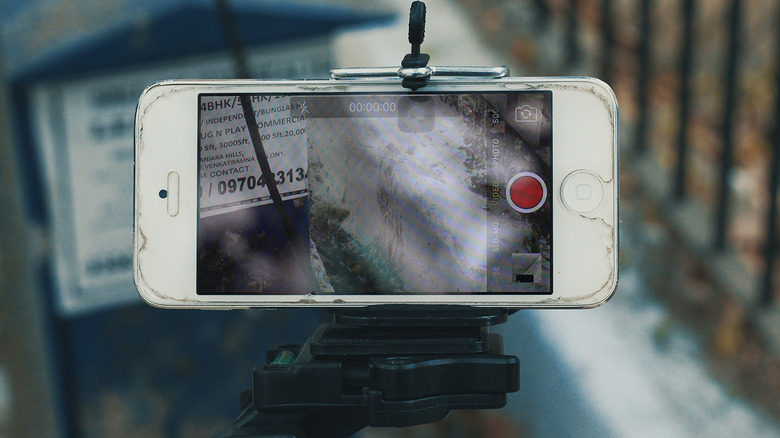 iPhone capturing a video on a tripod