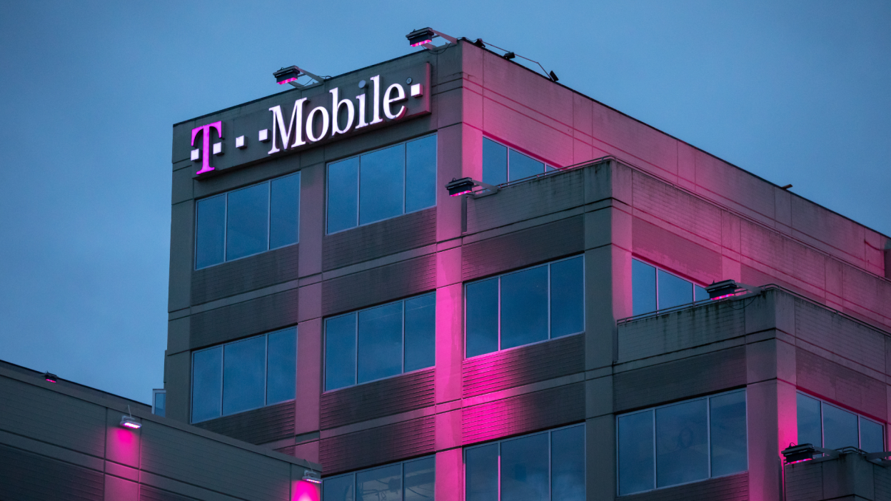 outside of T-Mobile building with sign lit up at night