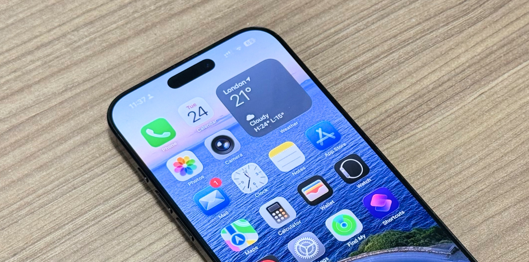 iPhone 16 Pro Max Home Screen running iOS 26 beta