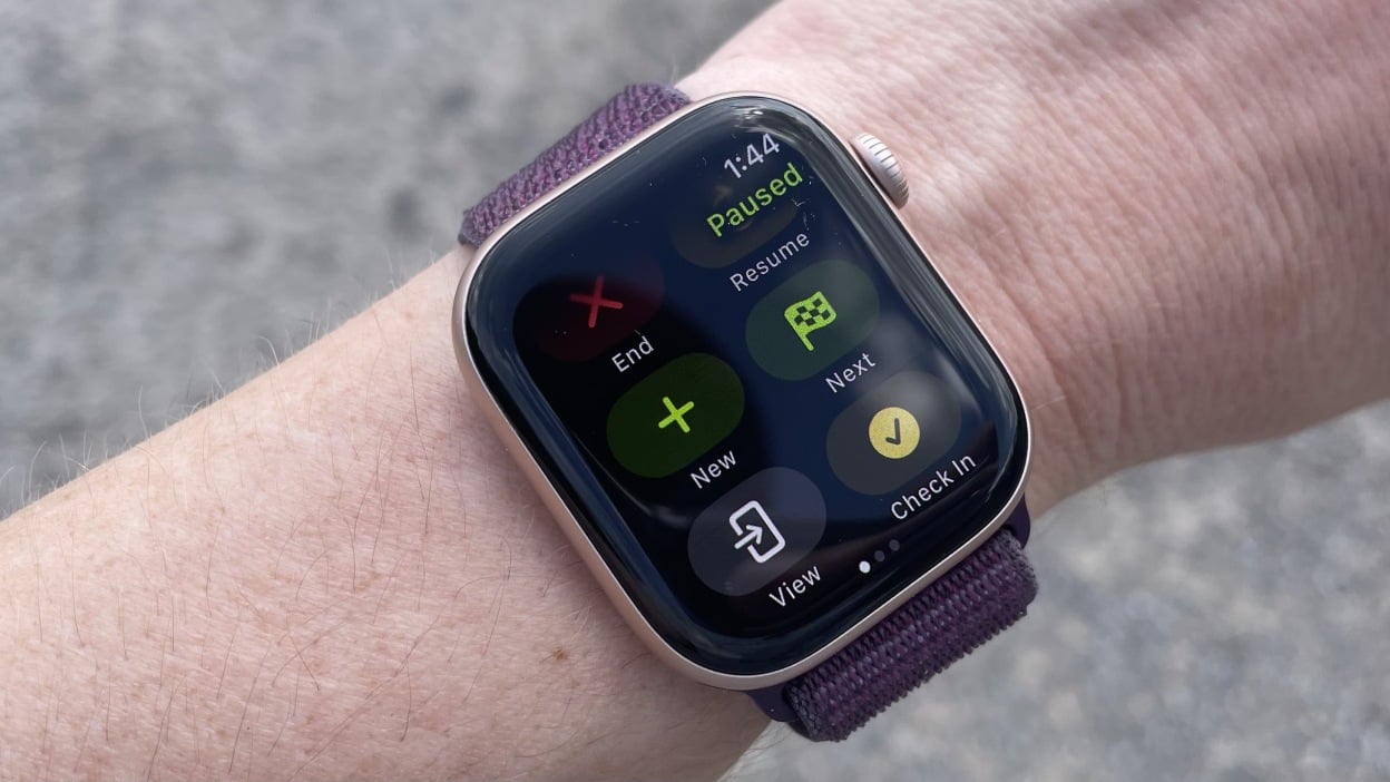 Apple Watch workout screen with option to view metrics on phone