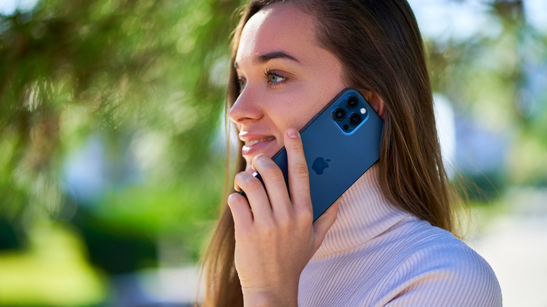 A person talking on the Apple iPhone 12 Pro