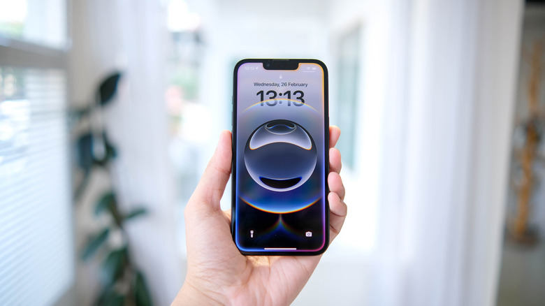 The iPhone 16e in hand.