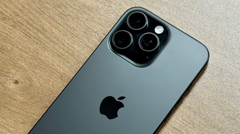 An iPhone 16 Pro facing down on a desk.