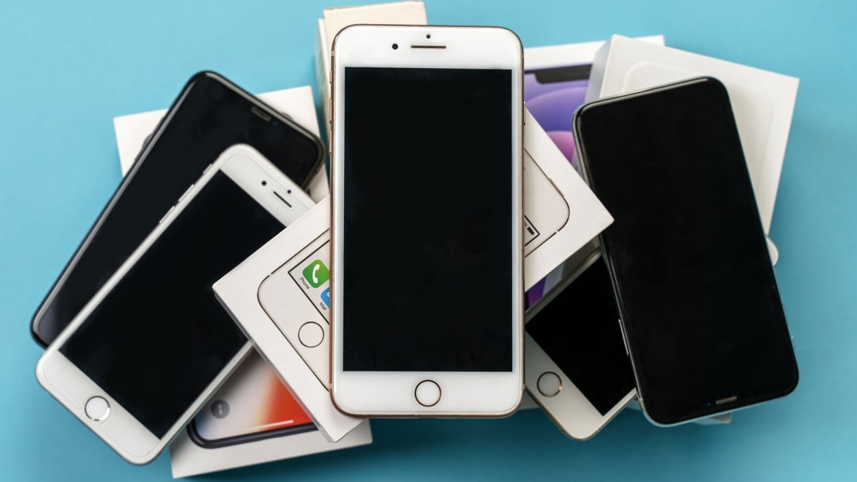 old iphones on a table