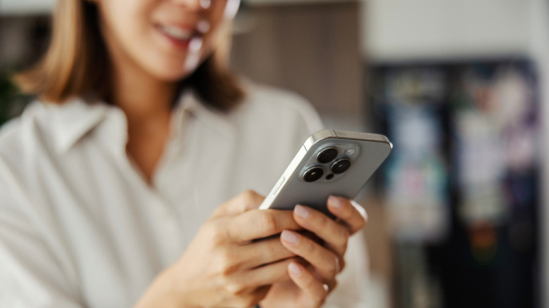 A person using an iPhone.