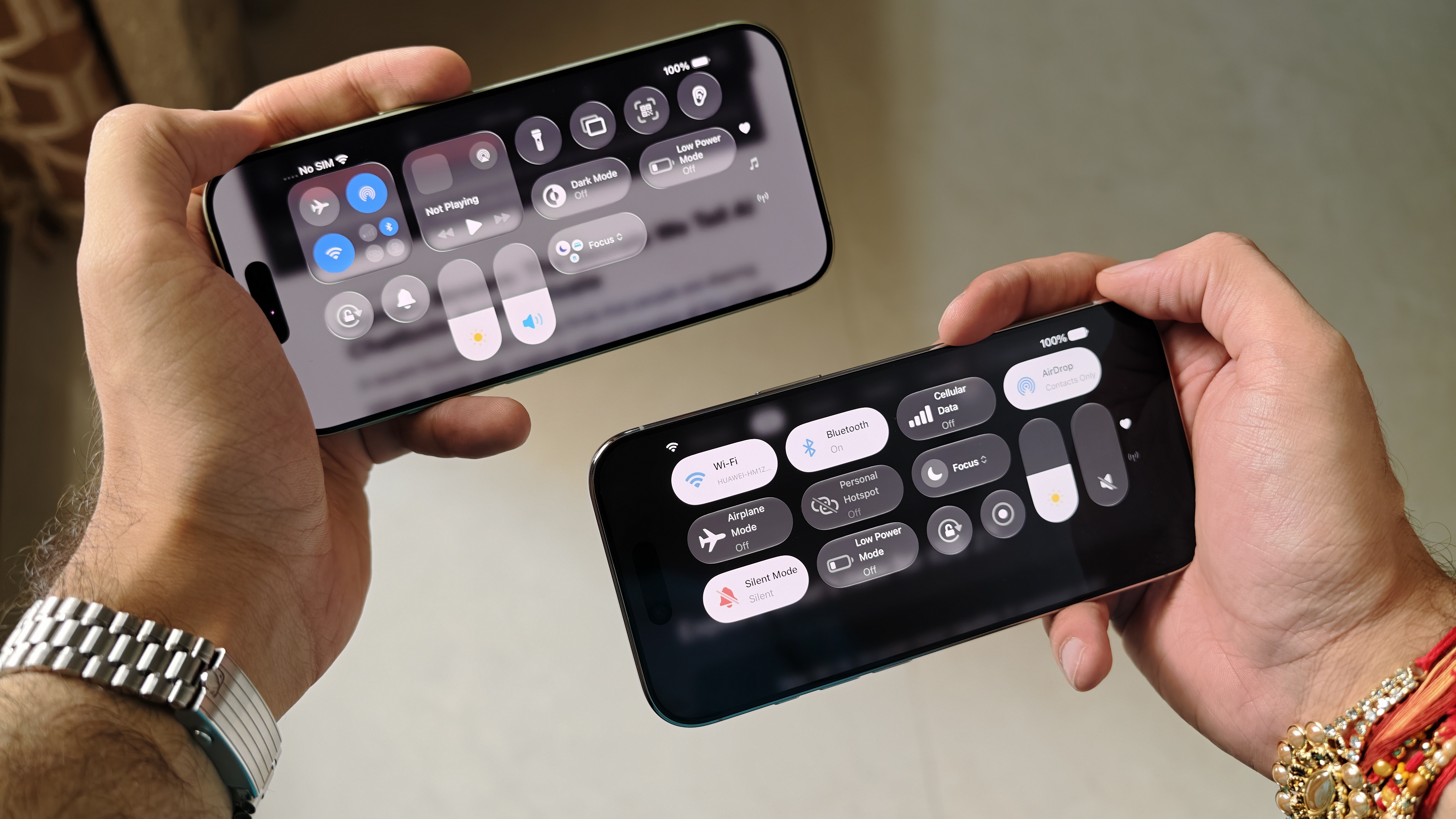 Prakhar Khanna holding an iOS 26-running iPhone 17 and iOS 27 beta-running iPhone Air