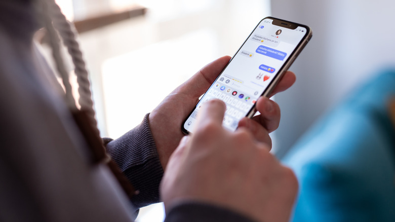 A person using iMessage on an iPhone