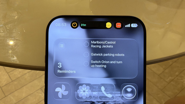 Close-up of three Live Activities on iPhone 18 Pro Max