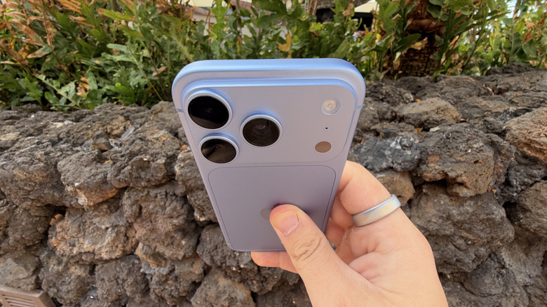 iPhone 18 Pro being held tilted towards the camera