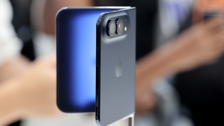 Apple's iPhone Duo, half-folded on a display stand.