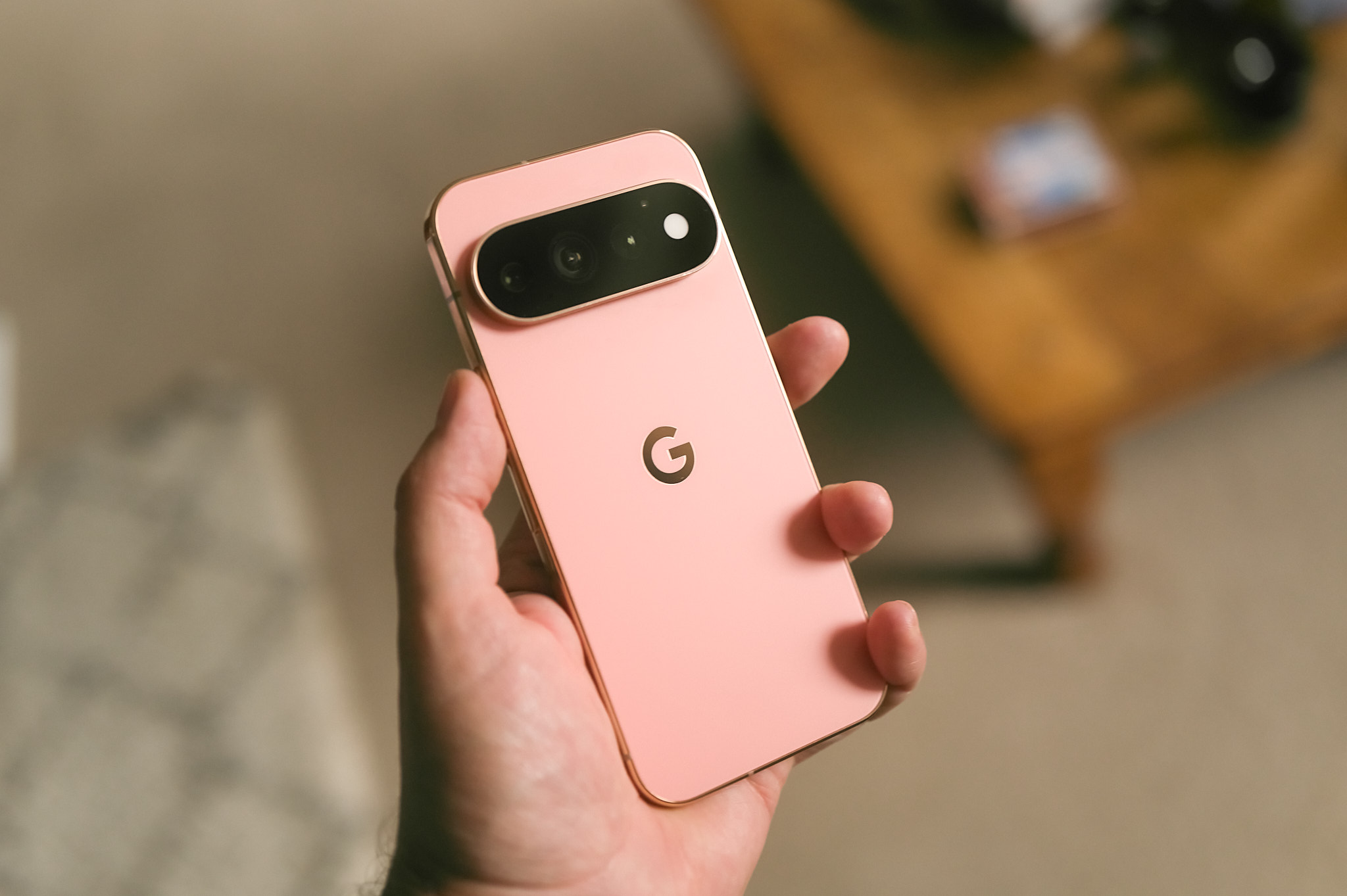 Image of a hand holding a Google Pixel phone